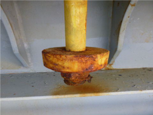 Hatch cover maintenance - Hatch securing cleat, seized and painted over.