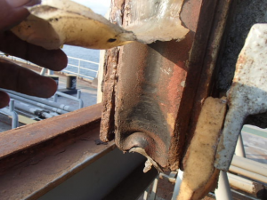 Hatch cover maintenance - silicone applied in an attempt to effect proper sealing.